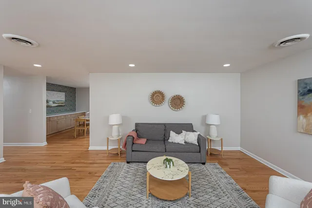 a living room with furniture and a rug