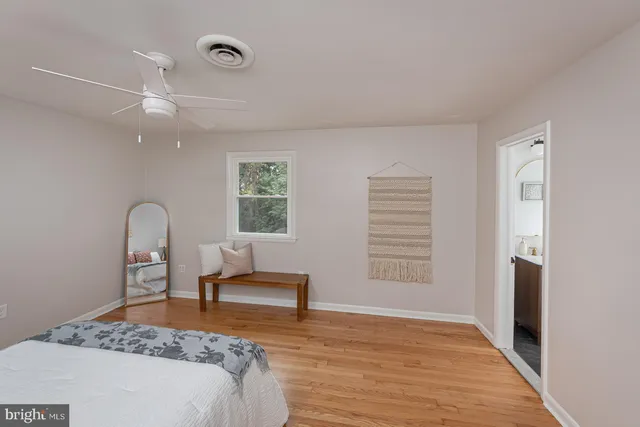 a bedroom with a bed and a chair