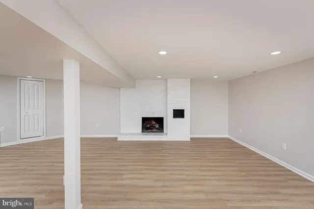 a view of a hallway with a wooden floor