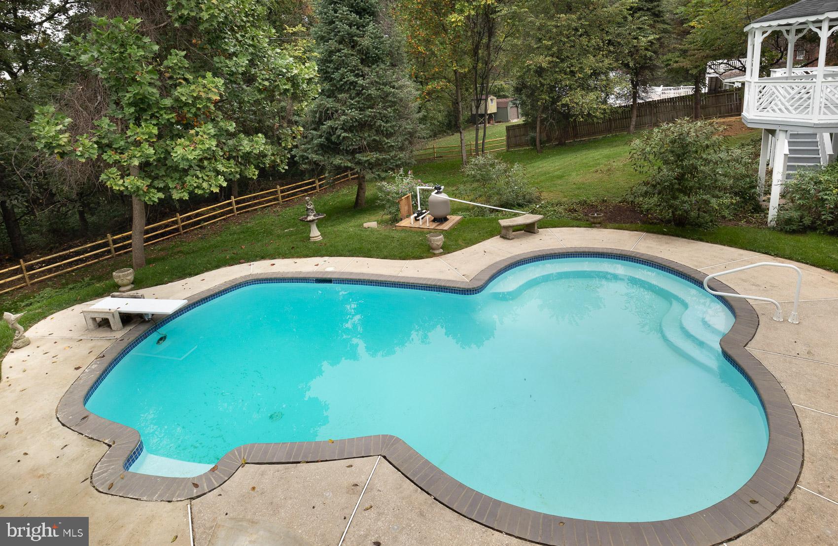 9508 Buckhorn Road Baltimore, MD 21234 - Photo 30 of 40 Tranquil poolside retreat in lush surroundings.
