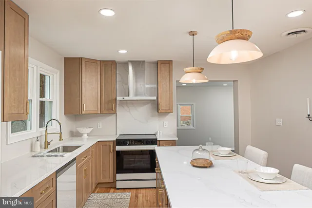 a kitchen with furniture a sink a window and cabinets