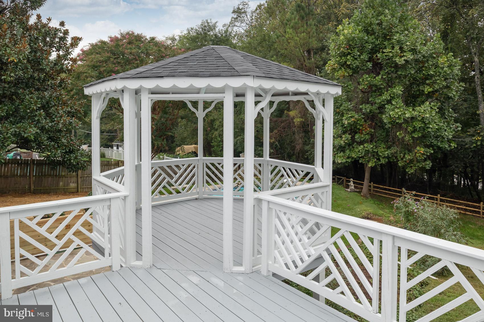 9508 Buckhorn Road Baltimore, MD 21234 - Photo 33 of 40 Charming white gazebo in a serene setting.