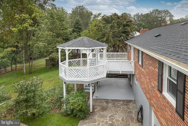 a balcony with a table and chairs