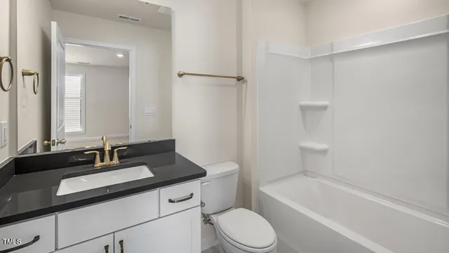 a bathroom with a sink a toilet and a bathtub