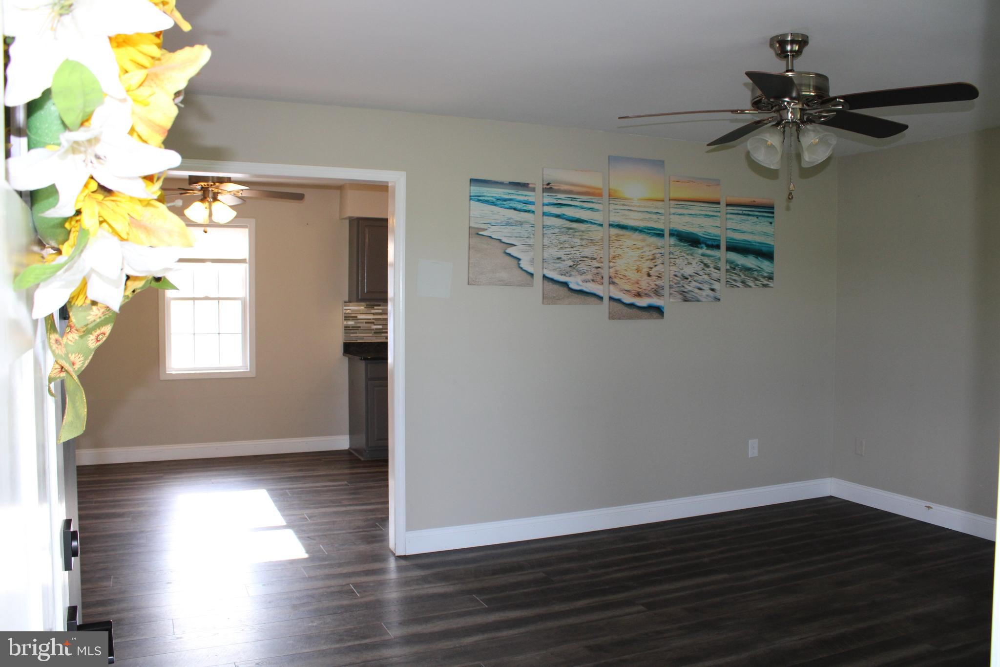 28380 Beaver Dam Branch Road Laurel, DE 19956 - Photo 16 of 22 a view of a room with wooden floor and staircase