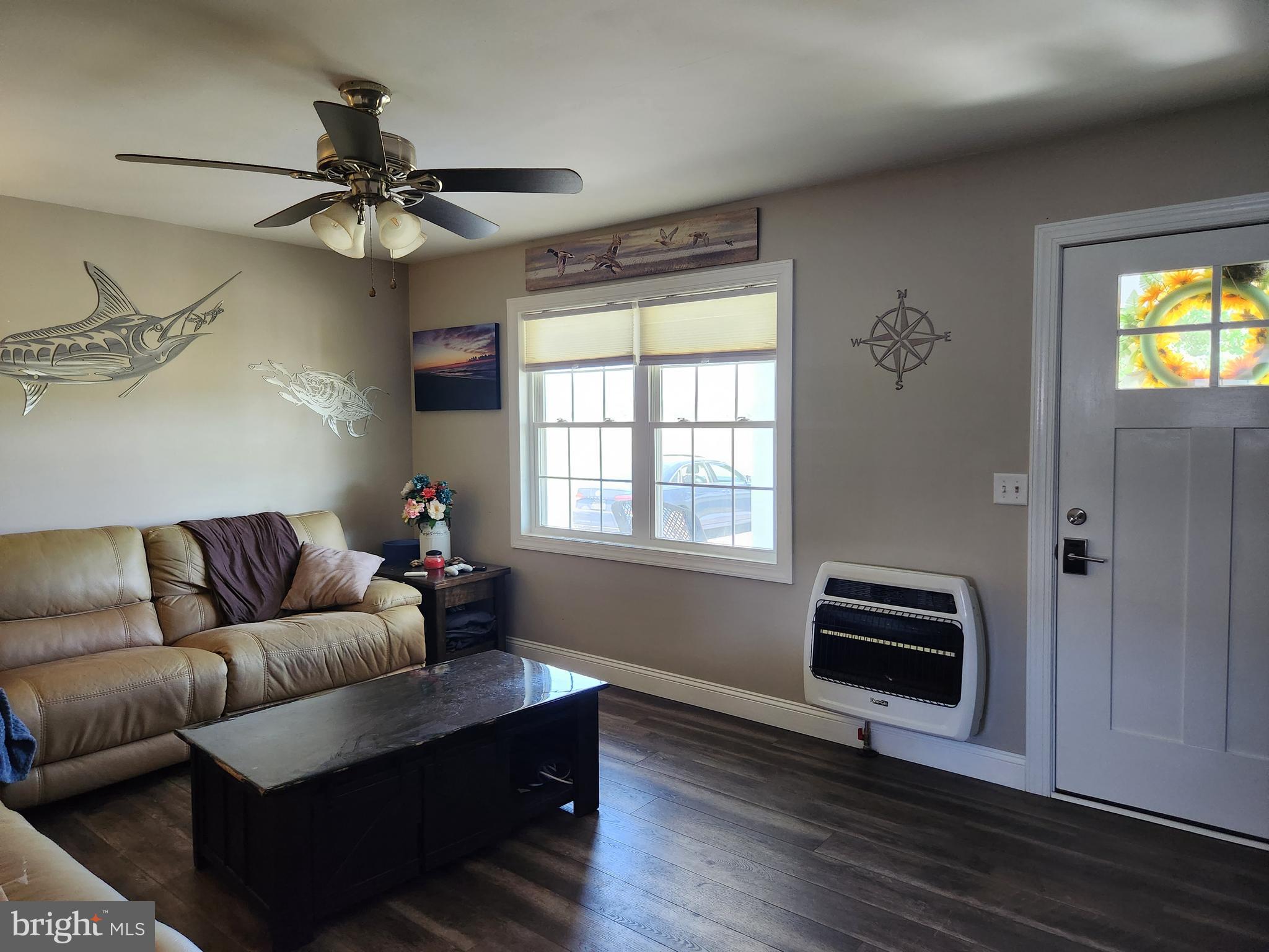 28380 Beaver Dam Branch Road Laurel, DE 19956 - Photo 7 of 22 a living room with furniture a ceiling fan and a window