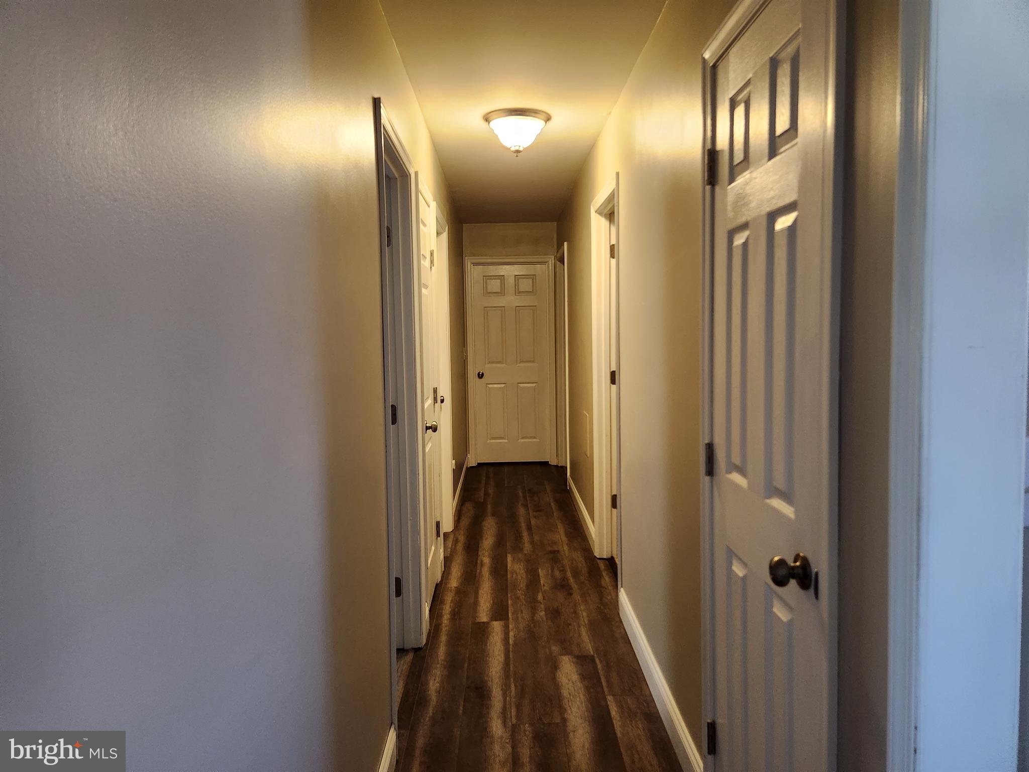 28380 Beaver Dam Branch Road Laurel, DE 19956 - Photo 9 of 22 a view of a hallway with wooden floor