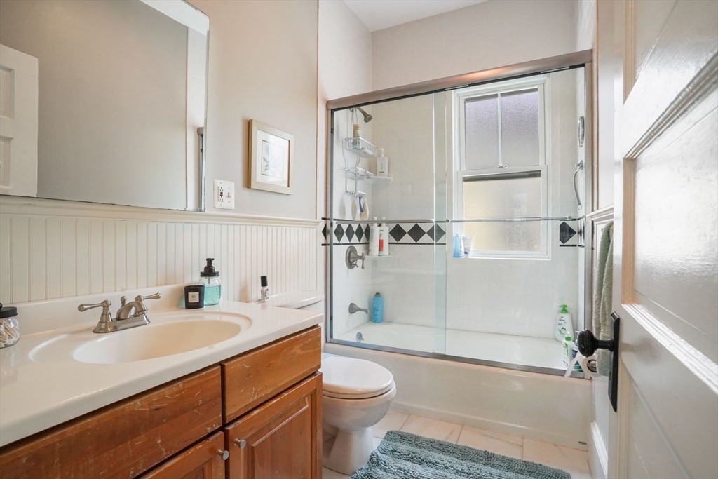 37 Dimick Street, Unit 3 Somerville, MA 02143 - Photo 9 of 12 a bathroom with a sink toilet and shower