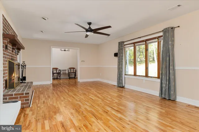 a kitchen with granite countertop a stove a sink and a microwave