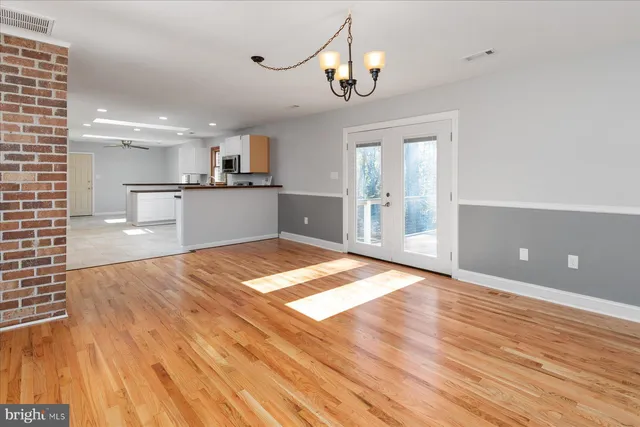 a kitchen with cabinets and stainless steel appliances