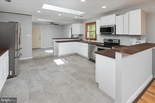 a bedroom with a bed and dresser