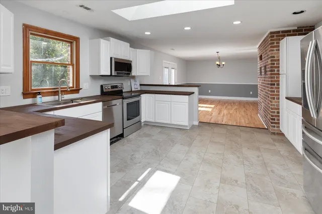 a bathroom with a bathtub and a sink