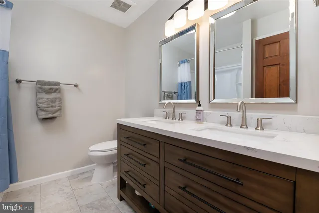 a view of a field with an ocean view