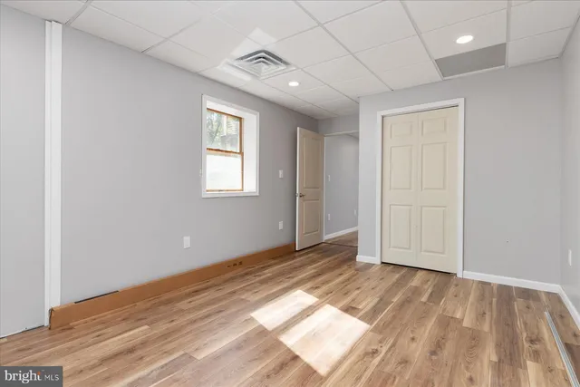 a view of a field with trees in front of it