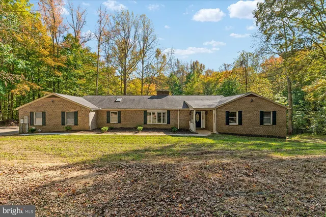 a view of a livingroom with furniture and wooden floor