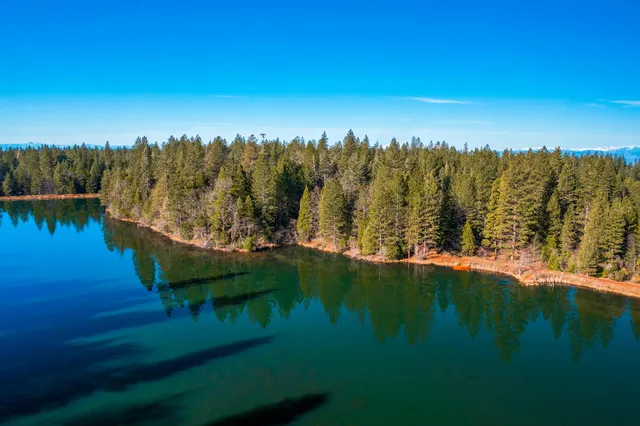 a view of lake with green space