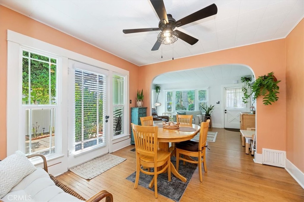 3398 Locust Street Riverside, CA 92501 - Photo 12 of 33 a dining room with furniture a flat screen tv and a large window
