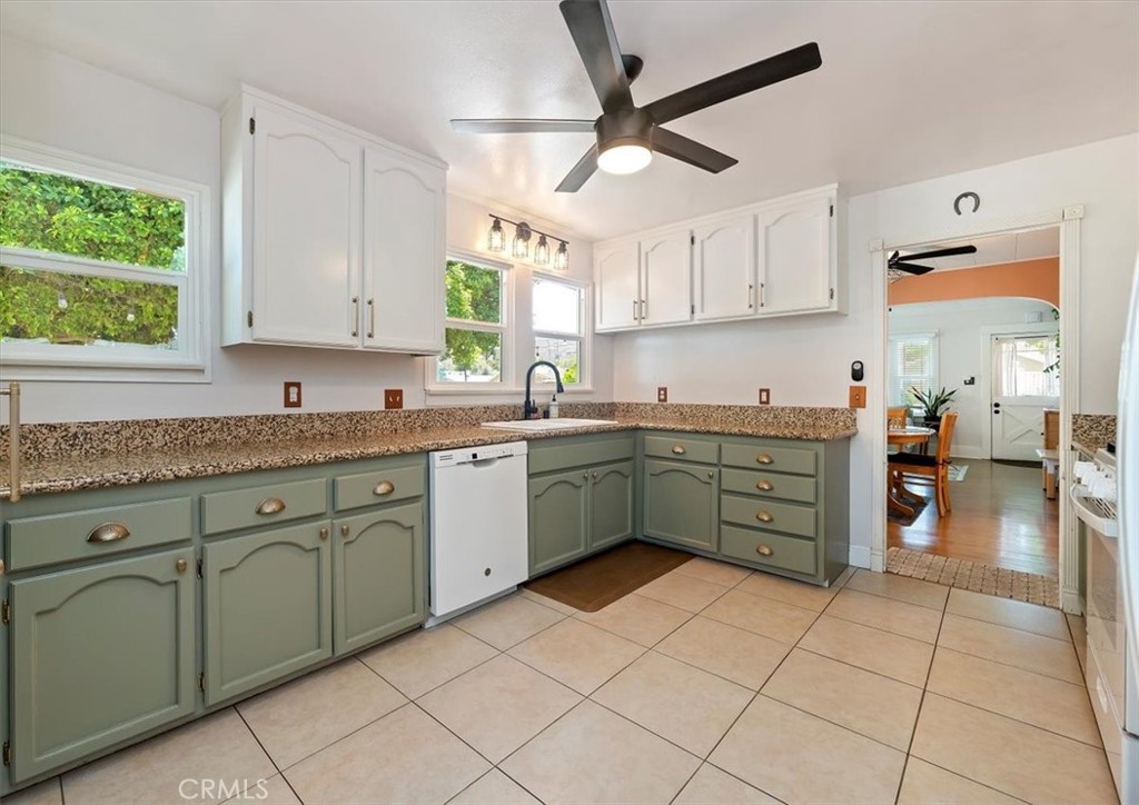 3398 Locust Street Riverside, CA 92501 - Photo 15 of 33 a kitchen with a cabinets and window