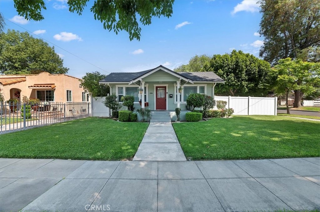 3398 Locust Street Riverside, CA 92501 - Photo 2 of 33 front view of a house with a yard