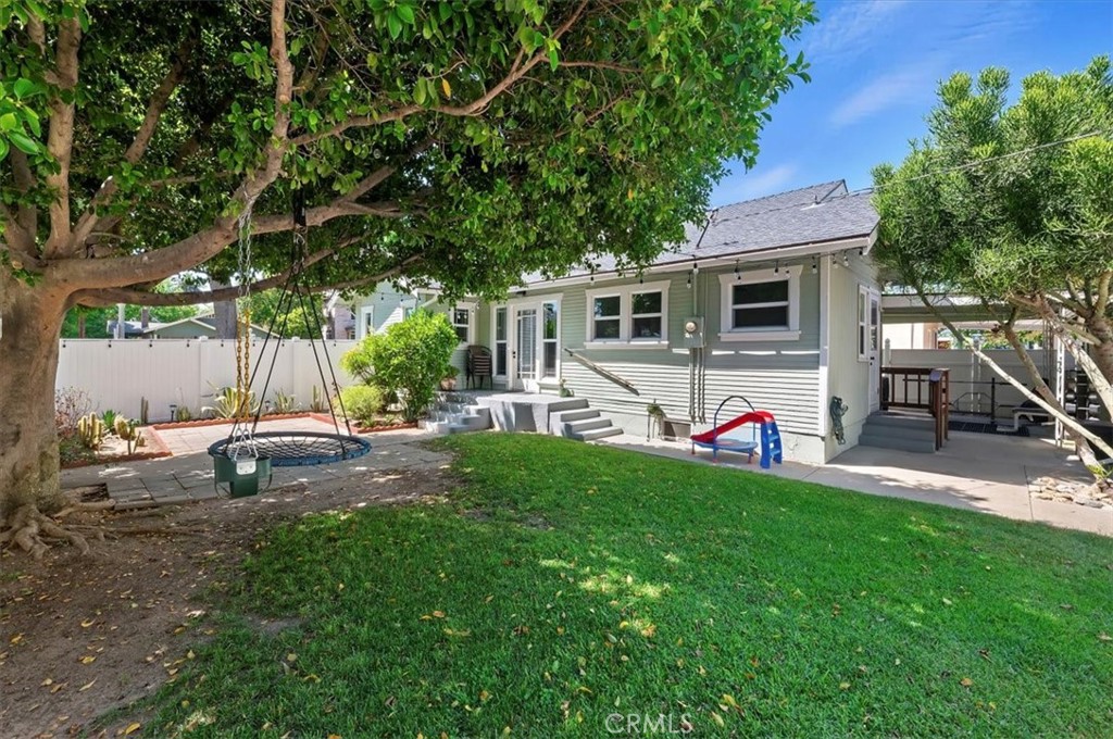 3398 Locust Street Riverside, CA 92501 - Photo 26 of 33 a view of a house with backyard and a tree
