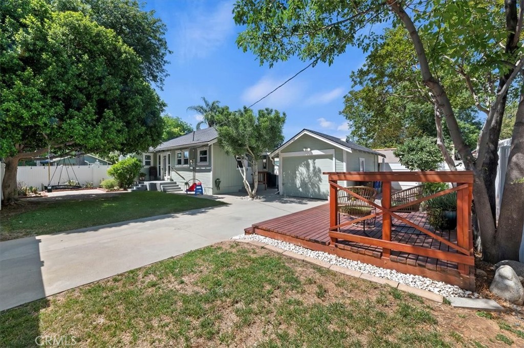 3398 Locust Street Riverside, CA 92501 - Photo 28 of 33 a view of a house with backyard and a tree