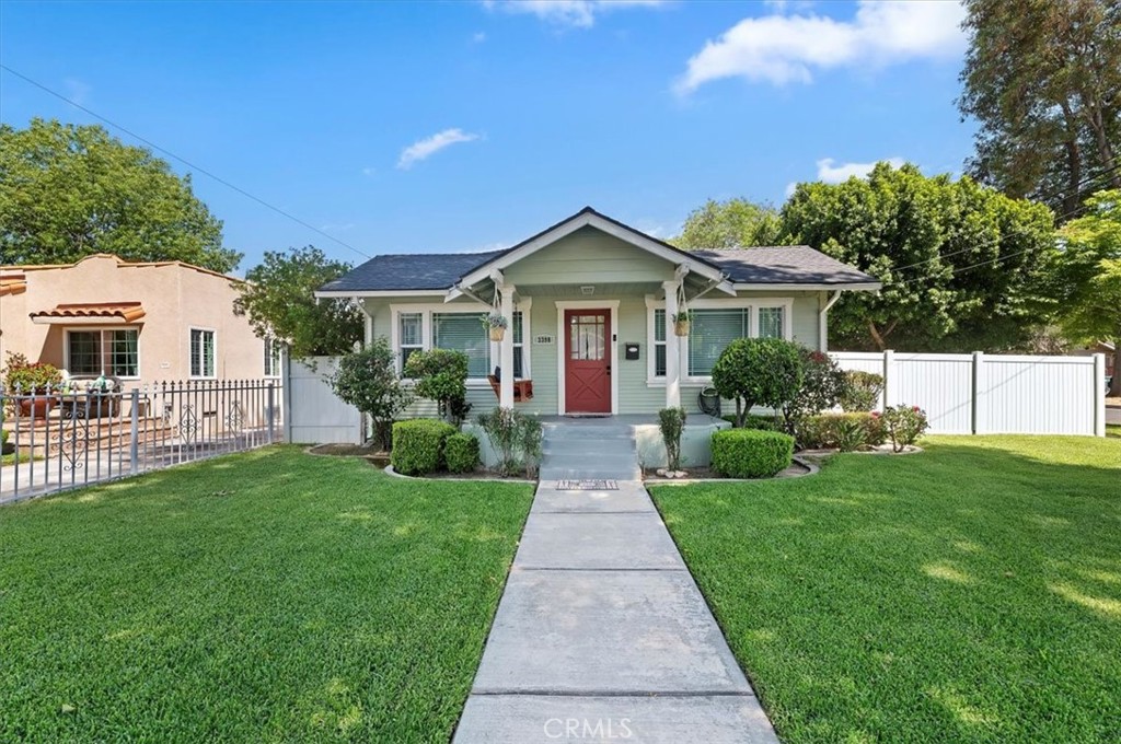 3398 Locust Street Riverside, CA 92501 - Photo 5 of 33 a front view of a house with a yard