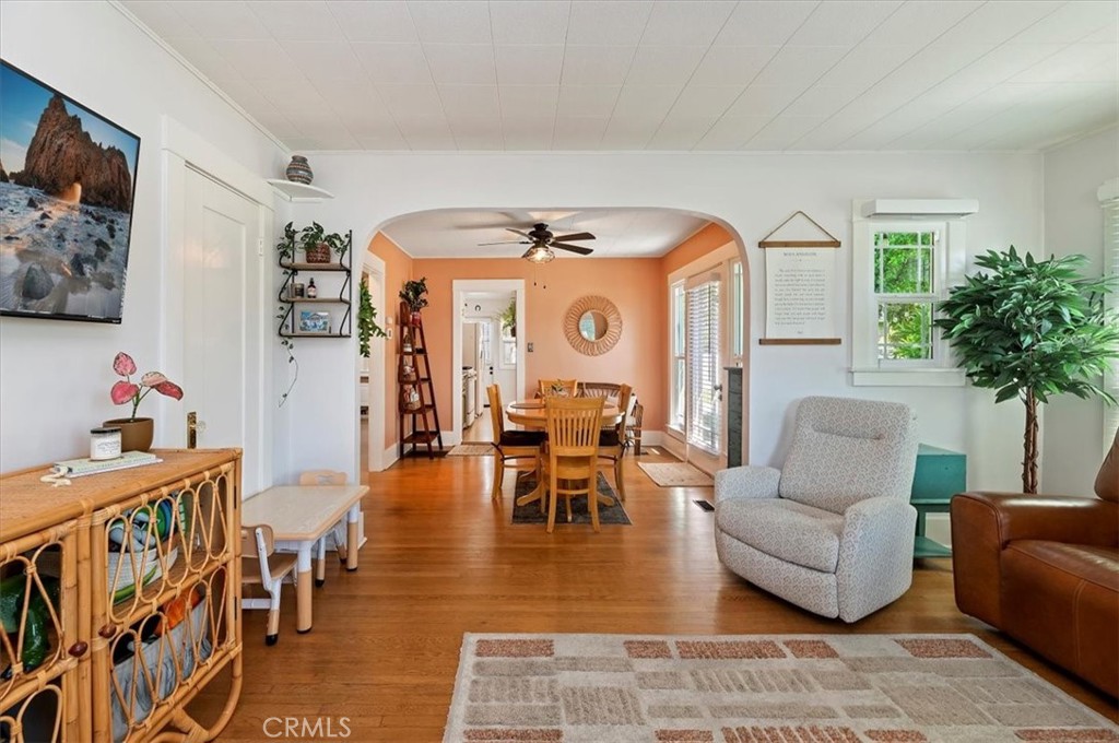 3398 Locust Street Riverside, CA 92501 - Photo 8 of 33 a living room with furniture and a clock
