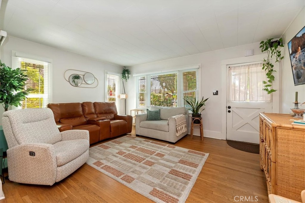 3398 Locust Street Riverside, CA 92501 - Photo 9 of 33 a living room with furniture and wooden floor