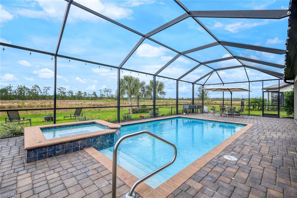 19477 The Pl Boulevard Estero, FL 33928 - Photo 11 of 36 a view of swimming pool with a back yard