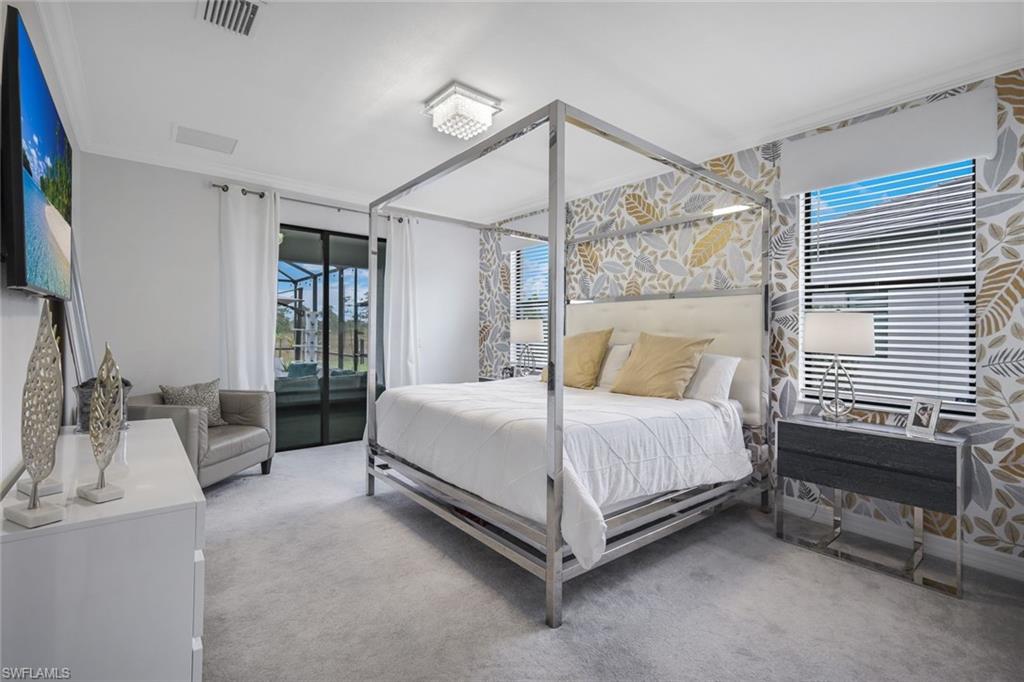 19477 The Pl Boulevard Estero, FL 33928 - Photo 12 of 36 a bed room with a bed and a couch