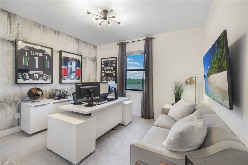 19477 The Pl Boulevard Estero, FL 33928 - Photo 14 of 36 a living room with furniture and a flat screen tv