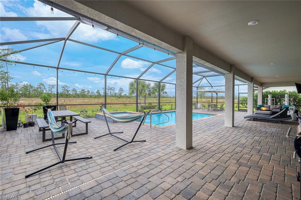 19477 The Pl Boulevard Estero, FL 33928 - Photo 22 of 36 a view of swimming pool with outdoor seating