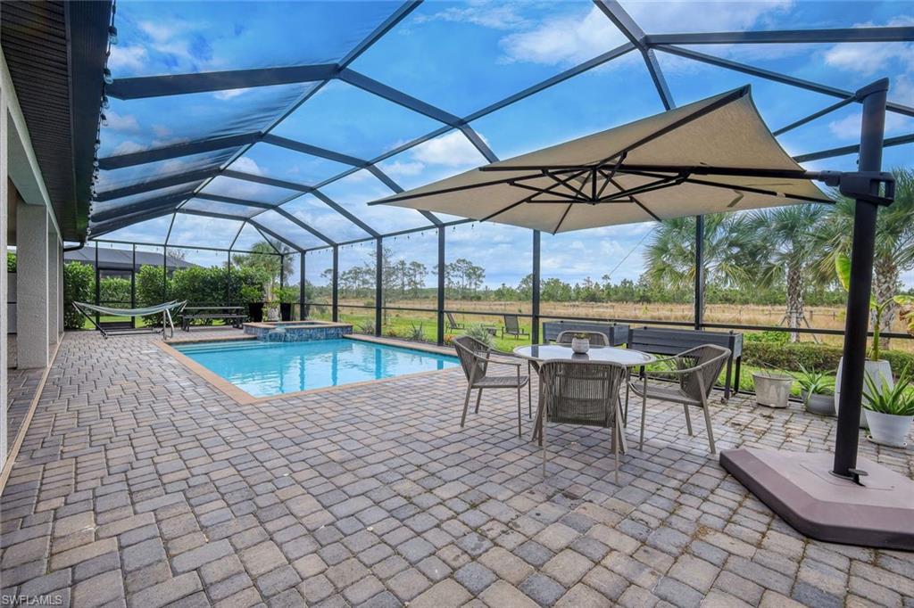 19477 The Pl Boulevard Estero, FL 33928 - Photo 25 of 36 a view of a swimming pool with a patio