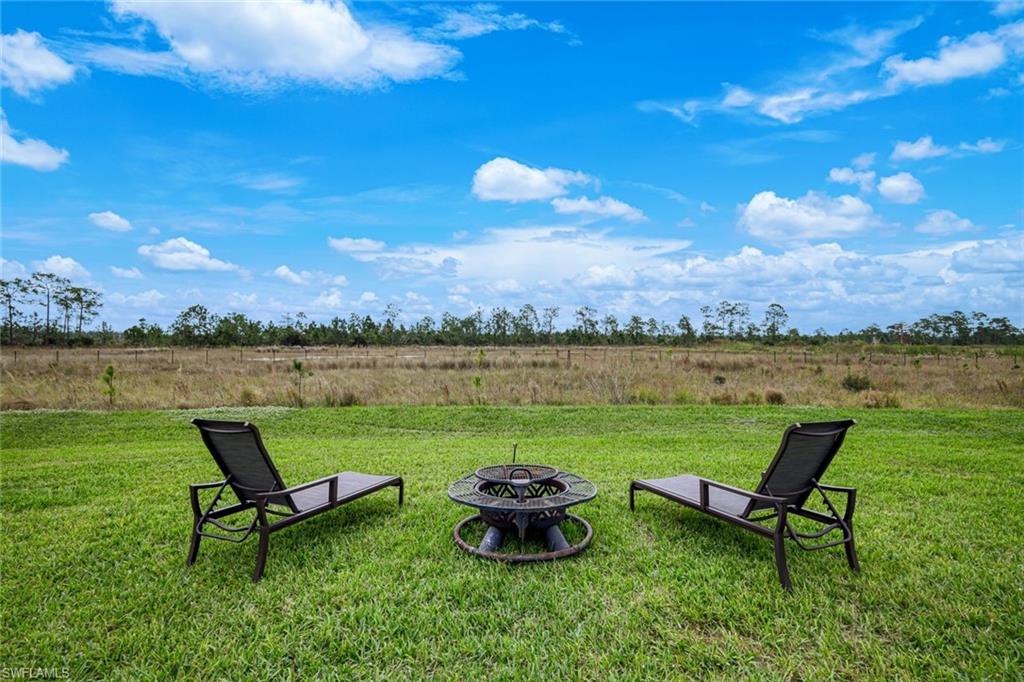 19477 The Pl Boulevard Estero, FL 33928 - Photo 26 of 36 a view of a lake with furniture and city view