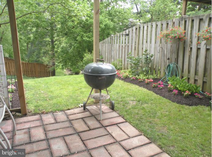 1721 Logmill Lane Gaithersburg, MD 20879 - Photo 14 of 16 a view of a backyard with a garden