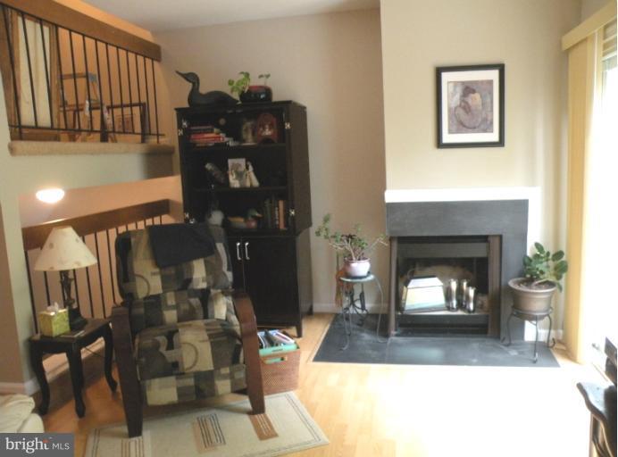 1721 Logmill Lane Gaithersburg, MD 20879 - Photo 15 of 16 a living room with furniture and a fireplace