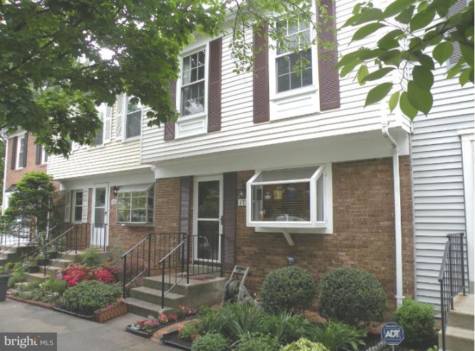 1721 Logmill Lane Gaithersburg, MD 20879 - Photo 16 of 16 a front view of a house with a garden
