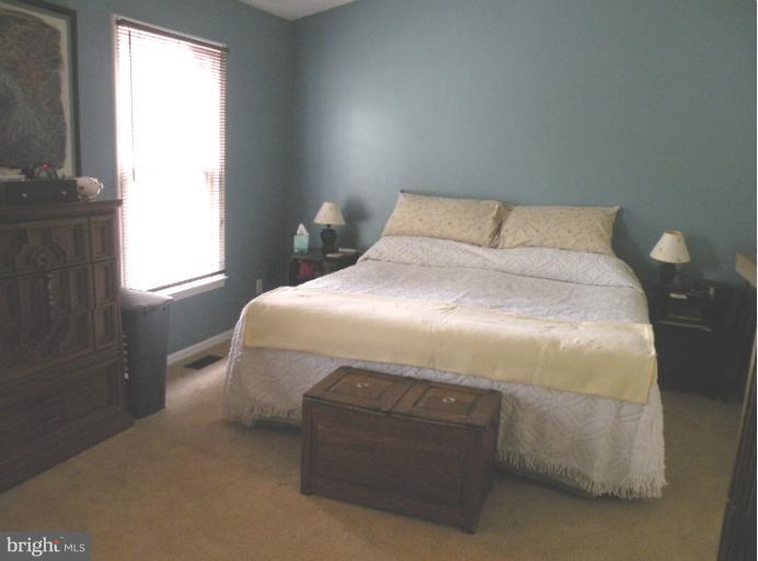 1721 Logmill Lane Gaithersburg, MD 20879 - Photo 3 of 16 a bedroom with a bed and window