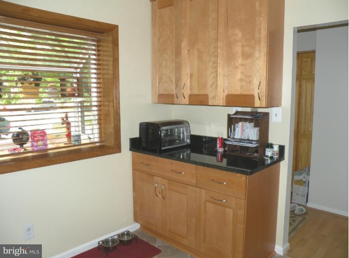 1721 Logmill Lane Gaithersburg, MD 20879 - Photo 8 of 16 a kitchen with a sink and a refrigerator