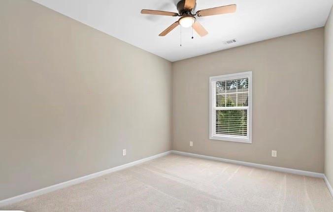 1063 Johnson Grove Atlanta, GA 30318 - Photo 19 of 23 an empty room with a window and a fan