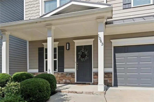 a front view of a house with a entryway