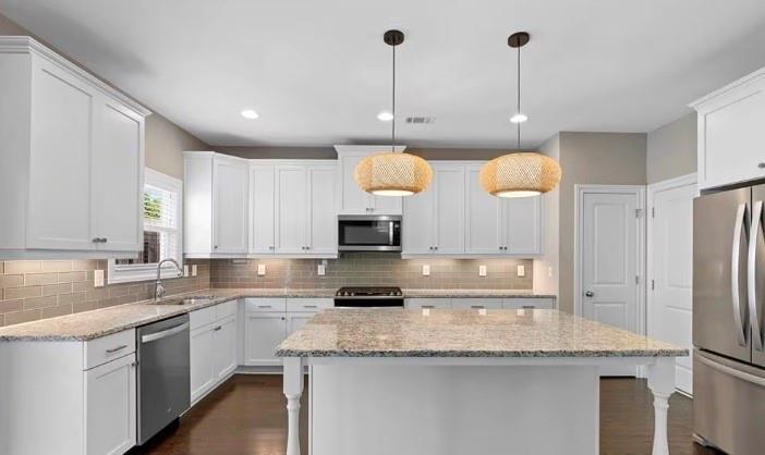 1063 Johnson Grove Atlanta, GA 30318 - Photo 8 of 23 a kitchen with stainless steel appliances granite countertop a sink a stove and refrigerator