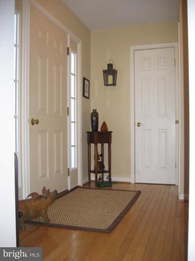 2511 Fairmount Road Hampstead, MD 21074 - Photo 11 of 30 a bedroom with a bed and wooden floor