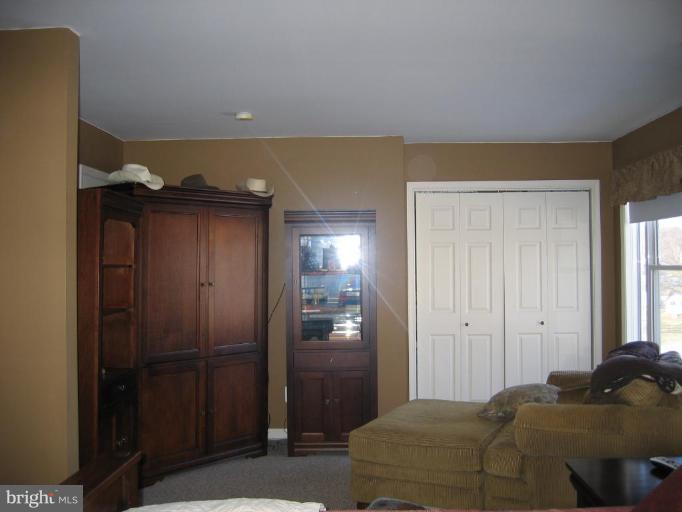 2511 Fairmount Road Hampstead, MD 21074 - Photo 15 of 30 a bedroom with a bed and a closet