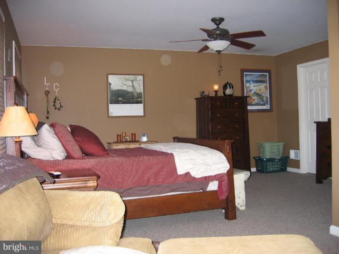 2511 Fairmount Road Hampstead, MD 21074 - Photo 16 of 30 a bedroom with a bed and dresser