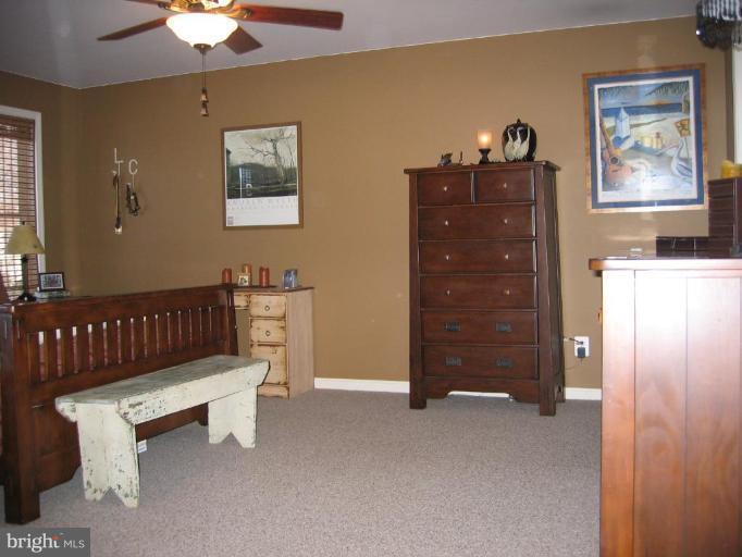 2511 Fairmount Road Hampstead, MD 21074 - Photo 18 of 30 a living room with furniture and a baby crib
