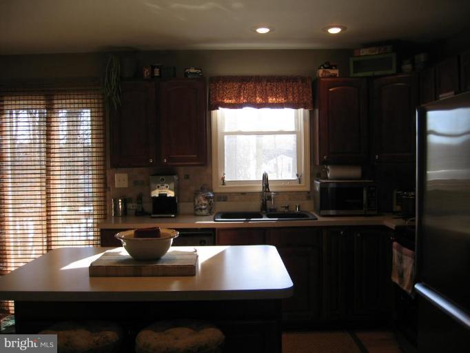 2511 Fairmount Road Hampstead, MD 21074 - Photo 25 of 30 a kitchen with a sink a window and appliances