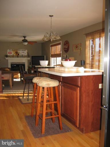 2511 Fairmount Road Hampstead, MD 21074 - Photo 3 of 30 a kitchen with stainless steel appliances granite countertop a sink a stove and a wooden floors
