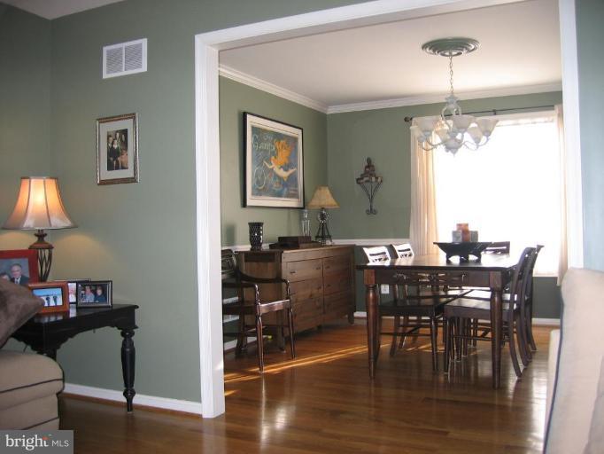 2511 Fairmount Road Hampstead, MD 21074 - Photo 7 of 30 a view of a dining room with furniture window and wooden floor