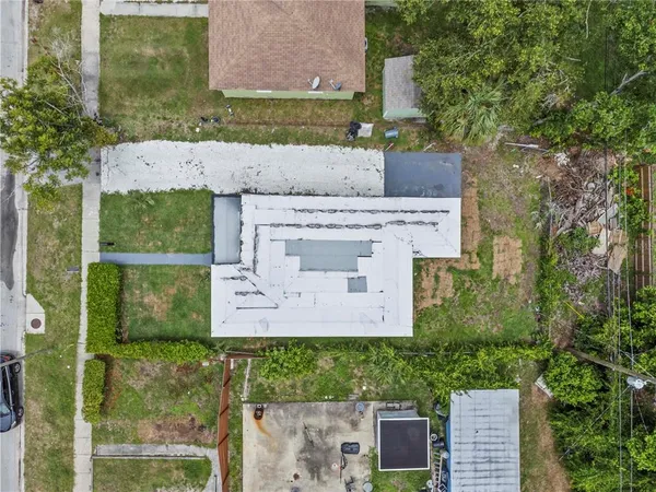 aerial view of a house with a yard